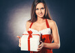 © yurolaitsalbert - stylish young woman in costume of Santa Claus with Christmas gif