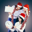 © yurolaitsalbert - happy women in costume of Santa Claus with clock, and Christmas shopping .