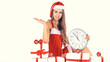 © yurolaitsalbert - beautiful young woman in Christmas suit with a clock sitting on the boxes with Christmas gifts.