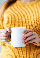 Sticker - closeup woman hands holding white mug for mockup design