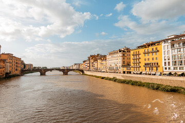 Wall Mural - Amazingly beautiful vintage town with colorful buildings near the river with the bridge in Florence, Italy