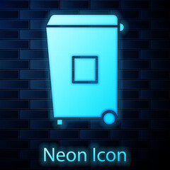 Sticker - Glowing neon Trash can icon isolated on brick wall background. Garbage bin sign. Recycle basket icon. Office trash icon. Vector Illustration