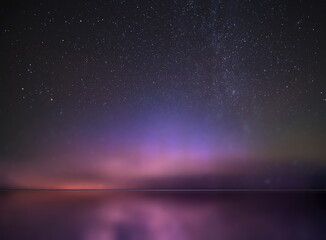 Wall Mural -   night  starry sky  and moon at sea lilac blue nebula cosmic milky way Aurora   seascape
