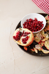 Wall Mural - Close up of fresh red pomegranate fruit and seeds healthy food