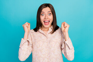 Wall Mural - Close up photo of lovely young woman raise fists celebrate lucky dressed stylish smart casual look isolated on aquamarine color background