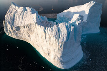 Aerial View Of A Big Ice Formation Along The Coast In A Fjord At Sunset, Sermersooq, Greenland.