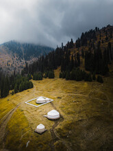 Aerial View Of Yurts On Mountain Covered With Fog In Almaty, Kazakhstan.
