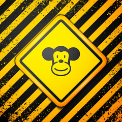 Poster - Black Monkey icon isolated on yellow background. Animal symbol. Warning sign. Vector