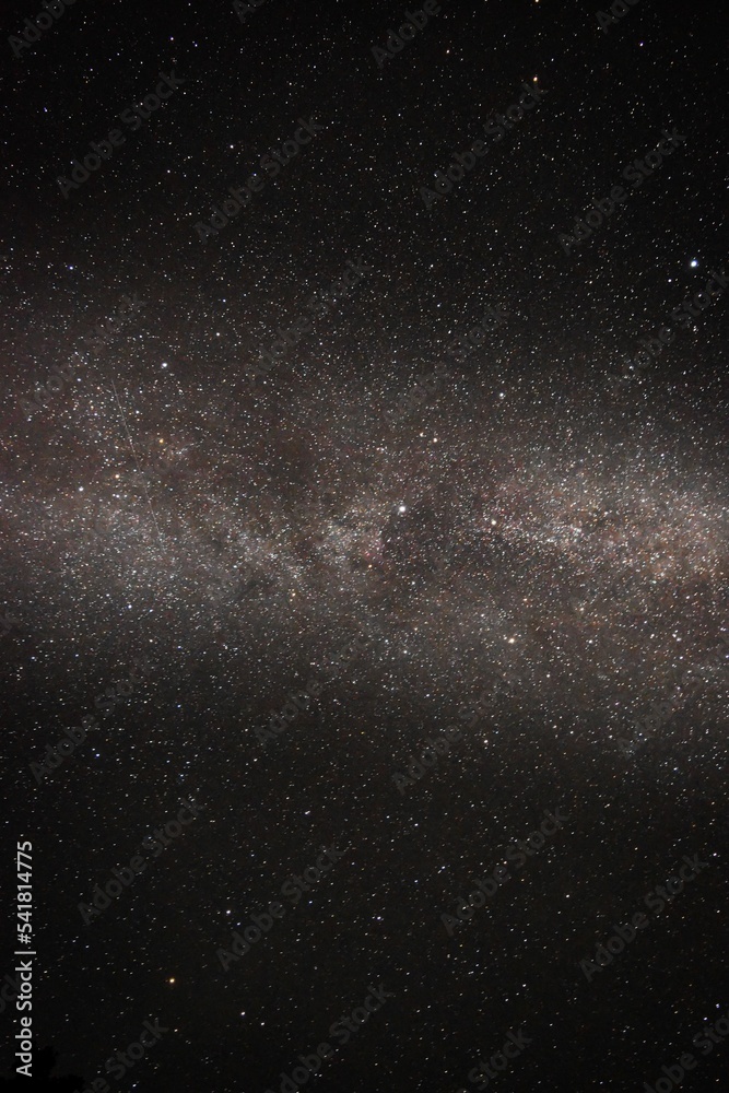 Vertical shot of the milky way in the night sky Stock Photo | Adobe Stock