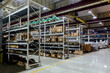 Industrial warehouse with machine spare parts and construction materials