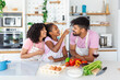 © Graphicroyalty - Happy loving family are preparing bakery together. Mother, father and child daughter girl are cooking cookies and having fun in the kitchen. Homemade food and little helper.
