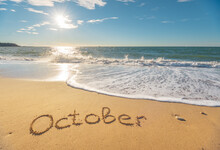 October Word On Sea Sand.