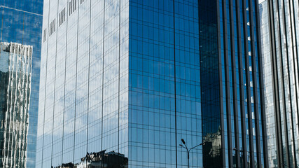 Close-up business center, modern buildings glass blue windows, skyscrapers exterior