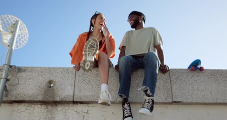 Wall Mural - Joke, fashion and wall with young couple hang out on city building together bonding. Interracial stylish young people on a funny city date. Silly, goofy and laughing black man and woman joking