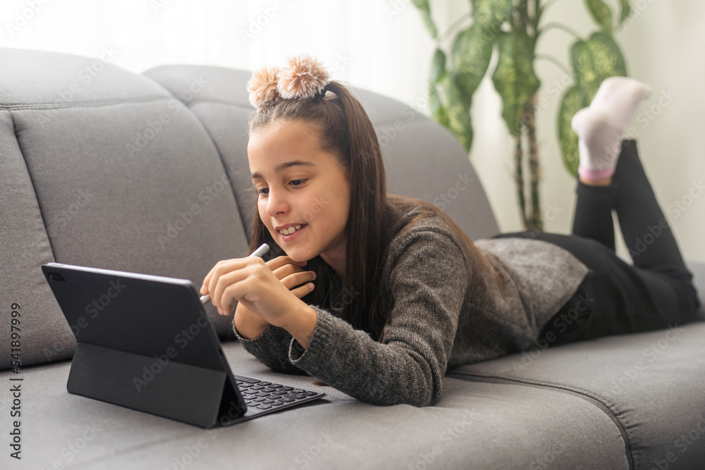 home, technology and internet concept - smiling teenage girl on the ...