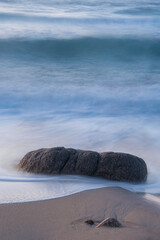 Canvas Print - Stunning landscape image of Sennen Cove in Cornwall during sunset with dramatic sky and long exposure sea motion