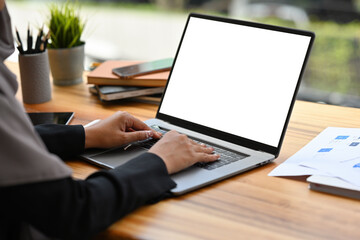 Wall Mural - Close up with Arabian Businesswoman working with laptop, Empty screen of laptop.