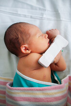 Sleeping Newborn In Hospital Bassinet