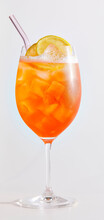 Aperol Spritz on white with straw