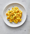 © Jennifer Causey - Scrambled eggs on white plate with chives
