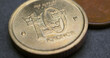Swedish coins lie on dark surface. 10 ten krona coin close up. National currency of Sweden. Money crown horizontal stories for news about economy or finance. Banking and credit. Wages and taxes. Macro