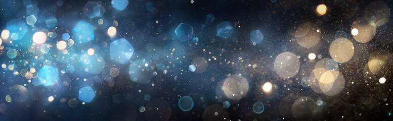 Wall Mural - golden and blue defocused lights in abstract background - christmas glittering at eve night