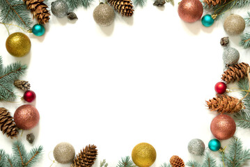 Wall Mural - christmas frame made of christmas tree branches, christmas toys and pine cones on a white background