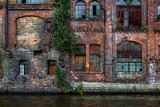 Fototapeta Tęcza - Grunge brick wall with windows