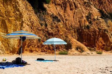 Umbrellas with a cliff in the background at Albufeira Portugal