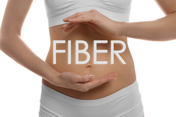 Woman holding hands near belly and word Fiber, closeup