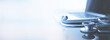 © tippapatt - healthcare and medicine background. Medical stethoscope and laptop computer on table with copy space. Online medical, e-health education, Health business web banner