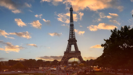 Wall Mural - The Eiffel Tower, iconic Paris landmark  as autumn trees park  as Seine river with sunset sky scene in Paris ,France