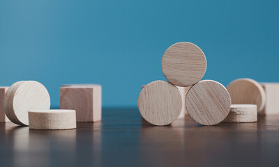 Wall Mural - Stacking blank wooden cubes on blue background with copy space for input wording and infographic icon. Empty brown wooden object block for symbol icon put technology, zero gravity, business concept.