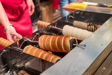 Process of baking chimney cake in a Christmas market