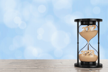 Aufkleber - New 2023 Year Concept. Sand Falling in Hourglass Taking the Shape from 2022 to 2023 year. 3d Rendering