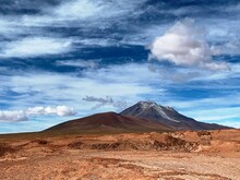 Mountain Volcano Ollague Stratovolcano On Border Between Bolivia And Chile. Maestic Andes Volcanic Mountain Landscape In Andean Nature Wilderness Reserve.