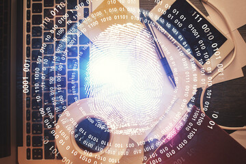 Poster - Finger print over computer on the desktop background. Top view. Double exposure. Concept of securitization.