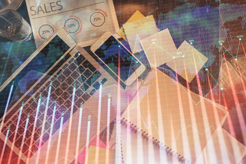 Poster - Financial market graph and top view computer on the desktop background. Multi exposure. Investment concept.