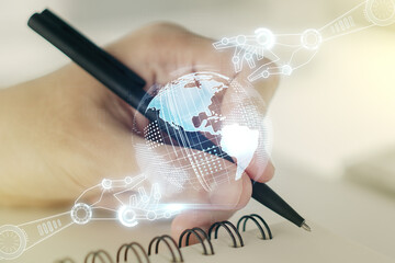 Aufkleber - Double exposure of robotics technology with world map hologram and man hand writing in notebook on background. Research and development software concept