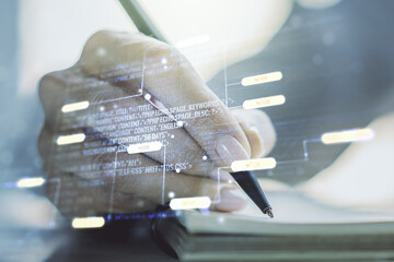 Poster - Multi exposure of abstract software development hologram and man hand writing in notebook on background, research and analytics concept