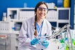 © Krakenimages.com - Young woman scientist working at laboratory