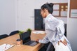 © Krakenimages.com - Young beautiful hispanic woman business worker suffering for backache at office