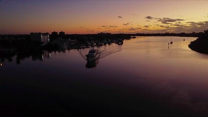 Sticker - Drone flyover shot of a yacht in a port in Florida, USA, during the golden hour landscape