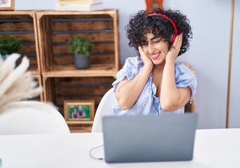 Poster - Young middle east woman listening to music and dancing at home