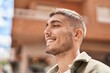© Krakenimages.com - Young hispanic man smiling confident standing at street