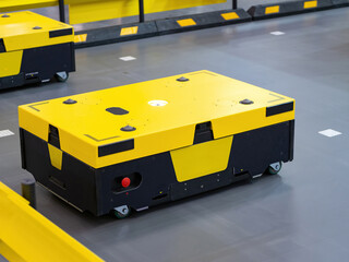 Poster - Warehouse robots. Automatic storage carts. Robotic warehouse equipment. Yellow carts for moving storage furniture. Automation warehouse process. Storage robots controlled by artificial intelligence