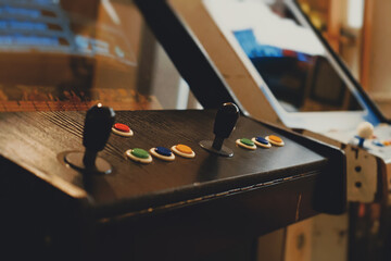 Joystick on arcade video game machine.