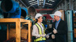 © NewSaetiew - Portrait of Professional Engineers express a high level of confidence and shake hand at the railway garage.