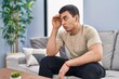 © Krakenimages.com - Young man stressed sitting on sofa at home