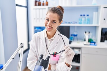 Sticker - Young woman scientist smiling confident at laboratory